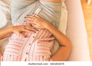 Woman with stomach ache. Young sick woman with hands holding pressing her crotch lower abdomen. Medical or gynecological problems, healthcare concept. 