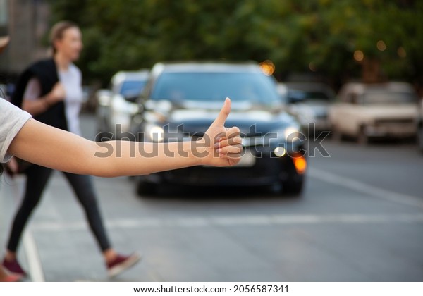 woman to stop a car in\
street