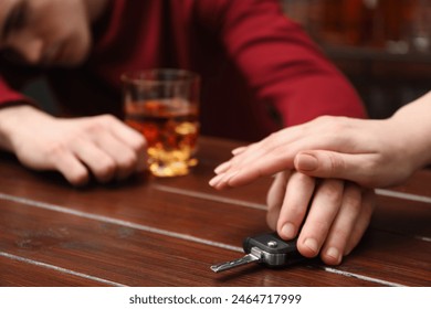 Woman stopping drunk man from taking car keys, closeup. Don't drink and drive concept - Powered by Shutterstock