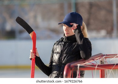 Woman Street Hockey Player Holdind Hockey Stick In Winter