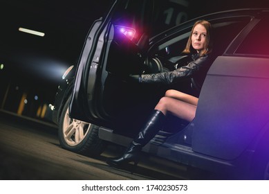 Woman Street Racer Gets Out Of Her Car And Lights Of A Police Flasher Concept.