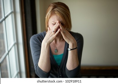 Woman with stress headache problem