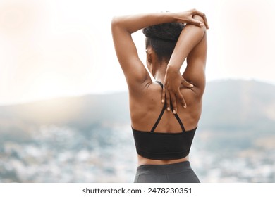 Woman, stretching and arm warm up for exercise, fitness and race training outdoor with back. Sport, health and wellness with start and hill at sunrise with workout and relax morning with view - Powered by Shutterstock