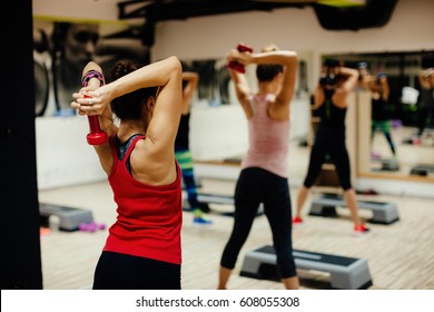 Woman Stretching Group. Women Fitness Class Indoors.