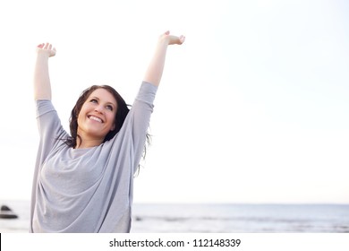 Woman stretching her arms to welcome the brand new day