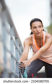 Woman Stretching Her Legs Before Exercise