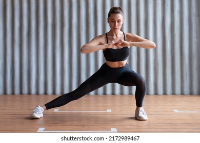 Woman Stretching Legs With Lunge Stretch Exercise.