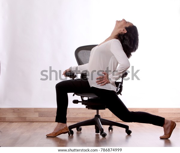 Woman Stretching in an\
office chair