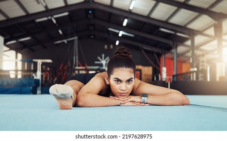 Woman Stretching On Floor At Health Gym, Doing Workout Exercise At Sports Club And Training For Fitness. Portrait Of An Athlete Or Gymnast Doing Gymnastics On Floor, Yoga For Wellness And Body