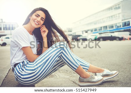 Similar – Image, Stock Photo Young woman in striped blouse smiling in urban setting