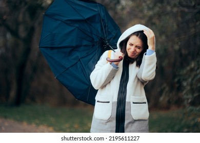 
Woman Struggling During Raining Storm Holding an Umbrella. Unhappy girl fighting windstorms outdoors in nature
 - Shutterstock ID 2195611227