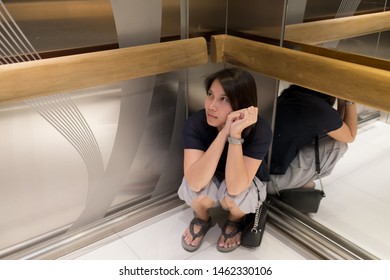 Woman Stuck In The Elevator, Girl Very Sad
