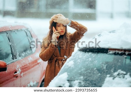 
Woman Stuck in the Snow with Broken Car Calls the Service. Stressed driver getting help and maintenance for broken car 
