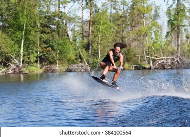 Woman Study Wakeboarding On A Lake