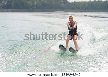 woman study waterskiing on a lake