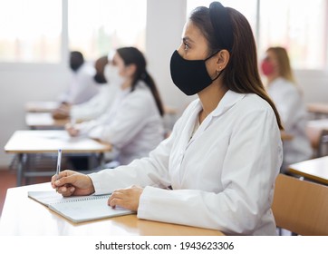 Woman Studying In Classroom With Colleagues Medicals In Protective Face Masks For Disease Prevention During Training Program For Health Workers