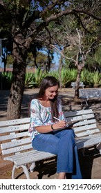 Woman Studying Or Working With A Tablet Computer Outdoors And Happy	