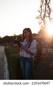 Woman Studying Or Working With A Tablet Computer Outdoors And Happy	