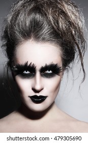 Woman With Stylish Fancy Gothic Halloween Make-up And Hairdo