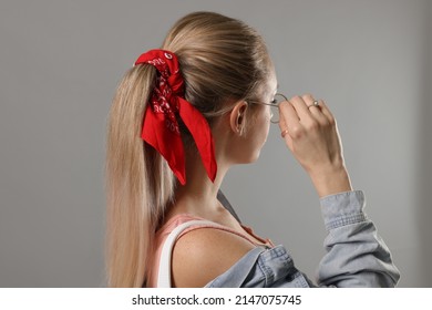 Woman With Stylish Red Bandana On Light Grey Background