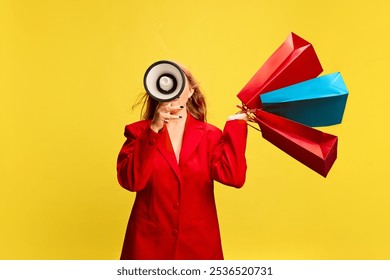 Woman in stylish red jacket talking in megaphone with many shopping bags against yellow background. Flash sale, last-minute exclusive deals. Concept of sales, shopping, announcement, advertisement - Powered by Shutterstock