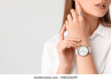Woman with stylish wrist watch on white background - Shutterstock ID 1984226249