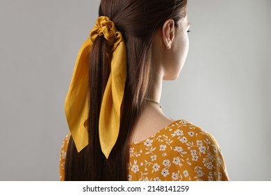 Woman With Stylish Yellow Bandana On Light Grey Background