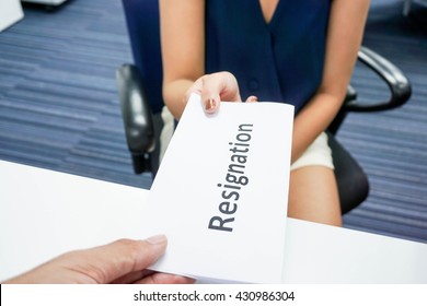 A Woman Submit A Resignation Letter To Her Boss