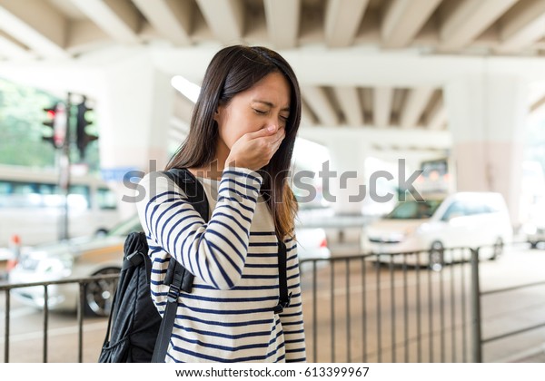 Woman suffer from nose\
allergy