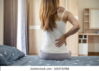 Woman Suffering From Back Ache On The Bed, Healthcare And Problem Concept