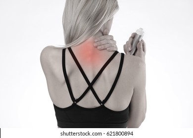 Woman Suffering From Back Pain Applying Pain Relief Cream . Sports Exercising Injury.