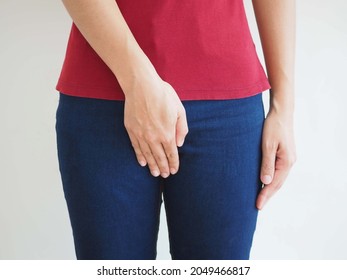 A Woman Suffering From Bladder Cancer. There Was Pain And Suffering. Concept Of Women's Health. Closeup Photo, Blurred.