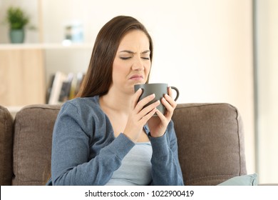 Woman Suffering Drink Bad Taste Sitting On A Couch In The Living Room At Home