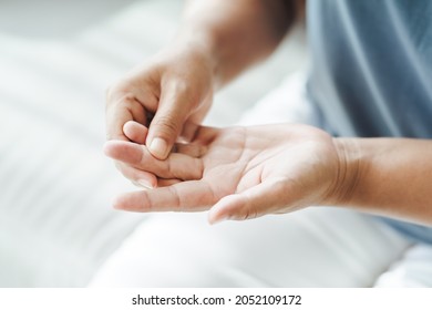 Woman suffering from hand and finger joint pain​.​ Causes of rheumatoid arthritis, carpal tunnel syndrome, gout. Health care and medical concept.