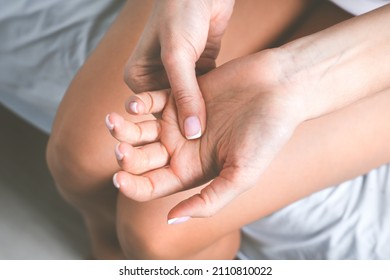 Woman Suffering From Hand Pain Or Finger Pain. Hand Numbness Or Limb Numbness. Massaging Painful Hand