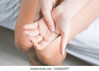 Woman Suffering From Hand Pain Or Finger Pain. Hand Numbness Or Limb Numbness After Sleep. Massaging Painful Hand