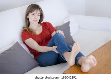 Woman Suffering From Leg Pain.