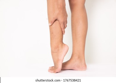 woman suffering from leg pain, calf pain. mono tone highlight at calf, leg isolated on white background. health care and medical concept - Shutterstock ID 1767538421