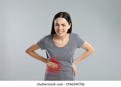 Woman Suffering From Liver Pain On Grey Background