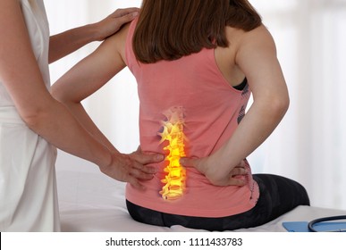 Woman Suffering From Low Back  Pain During Medical Exam. Chiropractic, Osteopathy, Physiotherapy. Alternative Medicine, Pain Relief Concept.