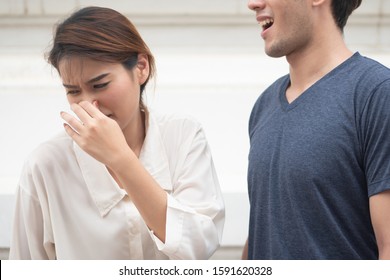 Woman Suffering From Man Bad Breath, Concept Of Tooth Decay, Gingivitis, Poor Oral Hygiene, Bad Breath Or Ordor Smell From Unhealthy Mouth, Poor Personality, Oral Hygiene Health Care