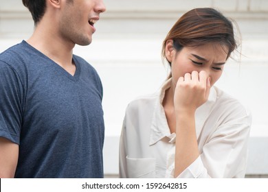 Woman Suffering From Man Bad Breath, Concept Of Tooth Decay, Gingivitis, Poor Oral Hygiene, Bad Breath Or Ordor Smell From Unhealthy Mouth, Poor Personality, Oral Hygiene Health Care