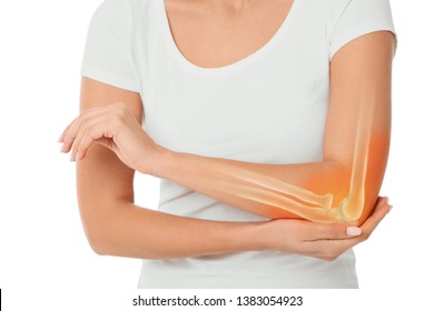 woman suffering pain in the elbow. Composite of image arm bones and elbow