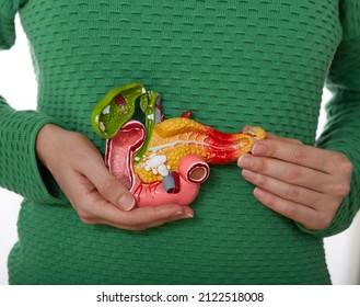 Woman suffering from pain in pancreas area and gallbladder. Treatment of pancreatic diseases, acute and chronic pancreatitis - Shutterstock ID 2122518008