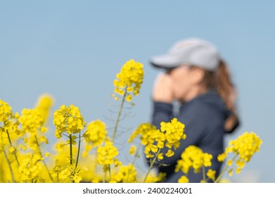 woman suffering from pollen allergy while training outdoors