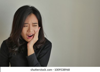 woman suffering toothache, girl with tooth decay, sensitivity, dental care treatment concept