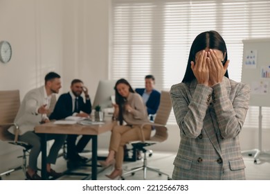 Woman suffering from toxic environment at work - Shutterstock ID 2212566783