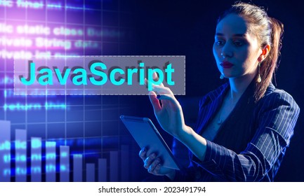 Woman in a suit clicks on a JavaScript button. Woman on dark background. Concept - she is team leader of developers. Team leader chooses JavaScript programming language. Manager chooses JavaScript