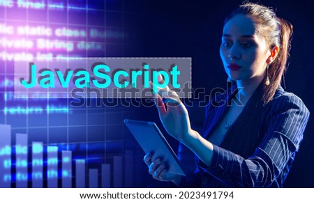 Woman in a suit clicks on a JavaScript button. Woman on dark background. Concept - she is team leader of developers. Team leader chooses JavaScript programming language. Manager chooses JavaScript
