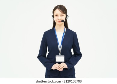 A Woman In A Suit Wearing A Headset